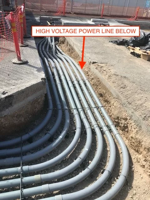Conduit route modification due to unforeseen conditions routed the conduit above a high voltage power line feeding the building